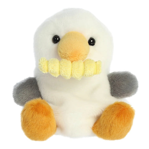 Plush toy penguin with a yellow beak on a white background
