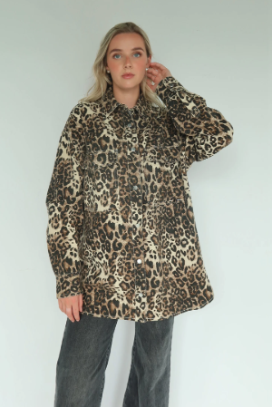 Person wearing a leopard print coat against a white background
