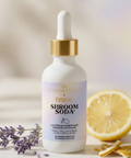 Bottle of Shroom Soda with lemon and lavender on a neutral background