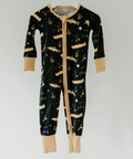 Black onesie with beige accents and animal print on a white background