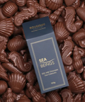 Rousseau Sea Beings chocolate packaging surrounded by chocolate sea creature shapes