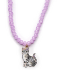 A lavender purple beaded necklace featuring a detailed silver and white cat pendant with a small purple flower crown, shown against a plain white background.