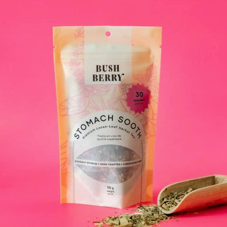Tea package labeled 'Bush Berry Stomach Soothe' on a pink background