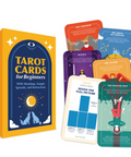 A boxed tarot card deck for beginners shown on a clean white background, with the yellow/orange box, several colorful cards fanned out behind it, and one card in front displaying the back design. No person, animal, or real environment is present, so this is Product/Packaging.
