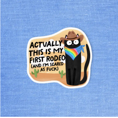 Sticker with a cartoon character wearing a cowboy hat and rainbow bandana, text 'Actually this is my first rodeo (and I'm scared as fuck)' on a blue textured background.