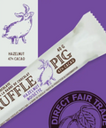 Chocolate bar packaging with 'Pig' branding and Direct Fair Trade logo on a purple background