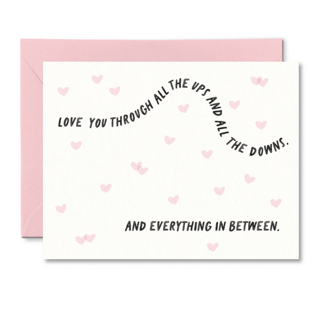 Card with romantic message and pink hearts on a white background