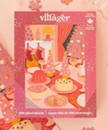 Villager 500 piece puzzle packaging with festive design on a pink background