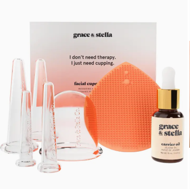 Grace & Stella cupping set with facial cups and carrier oil on a white background