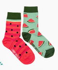 Two pairs of socks with watermelon designs on a white background
