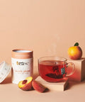 Tea canister labeled 'tease' with a glass of tea, peach slices, and an orange on a beige background.