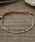 Multicolored beaded bracelet on a wooden surface