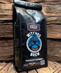 Coffee bag labeled 'Witches Brew' from Coffin Creek on a wooden background