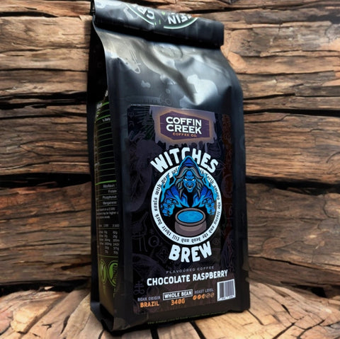 Coffee bag labeled 'Witches Brew' from Coffin Creek on a wooden background