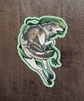 Sticker of a wolf on a wooden surface