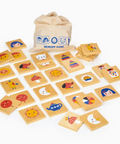Wooden memory game with cards and a drawstring bag on a white background
