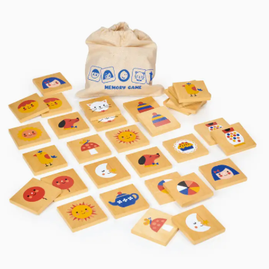 Wooden memory game with cards and a drawstring bag on a white background