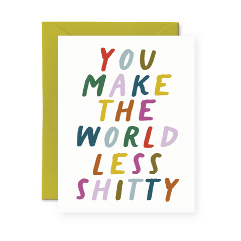 Greeting card with colorful text 'You Make the World Less Shitty' on a white background