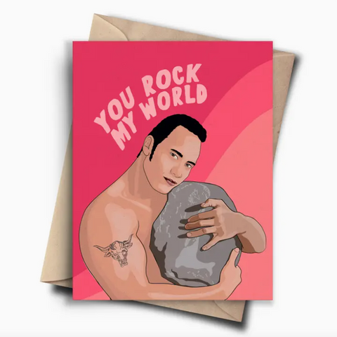 Greeting card with a man holding a rock and 'You Rock My World' text on a pink background