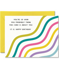 Birthday card with colorful wavy lines and humorous text on a white background