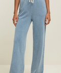 Light blue wide-leg pants worn by a person on a neutral background